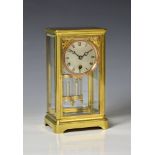 A brass cased four glass mantel clocklate 19th century, possibly American with French single train