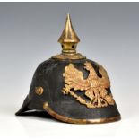 A WWI Imperial German Prussian Infantry Pickelhaube black leather bodied with eagle helmet plate,
