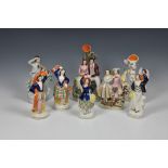 A collection of 19th century Staffordshire figural groups of couples and dancers, of varying forms
