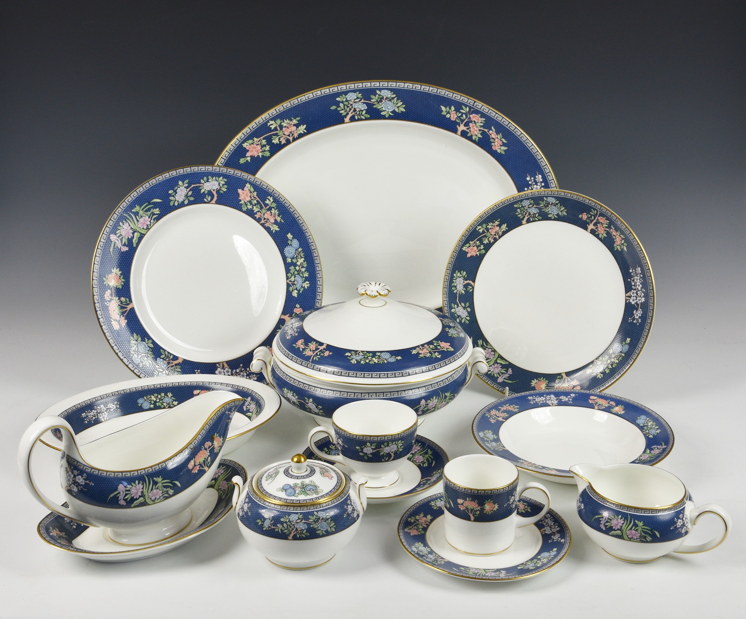 A large collection of Wedgwood "Blue Siam" pattern tea and dinner ware to include two soup tureens