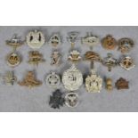 Military interest - A collection of cap badges to include Irish Rifles; The King's Own (