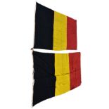 Two vintage cotton Belgian National Flags with wooden toggles, the largest measuring 56 x 103in. (