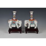 A pair of Chinese export porcelain famille rose elephant candle holders second half 20th century,