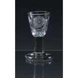 A rare mid-18th century Jacobite firing glass c.1750, the rounded funnel bowl engraved with a