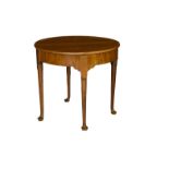 A Georgian walnut demi-lune gateleg tea table the fold-over top lifting to reveal storage beneath,