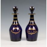 A pair of 19th century Bristol blue glass decanters