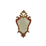A red lacquer and gilt cartouche style mirror *Repairs.