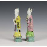 A pair of Chinese porcelain figures of deities, late Qing dynasty 9in. (22.9cm.) high.