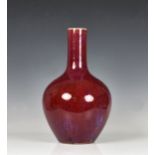 A Chinese porcelain flambé glazed bottle vase probably 19th century, 16in. (40.7cm.) high.