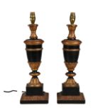 A pair of ebonised and giltwood table lamps *Plugs removed, one on/off switch snapped but still