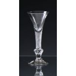 A mid-18th century composite stemmed airtwist wine glass c.1750, the drawn trumpet bowl over a