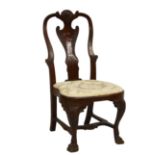 A 19th century walnut George II style chair the foliate, scroll and rosette carved vase splat to a