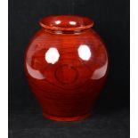 A Chinese turned and lacquered elm wood vase late 20th century, of ovoid form with everted rim and