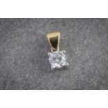 An 18ct two colour gold and single stone diamond pendant the approx. 0.31ct stone in a four claw