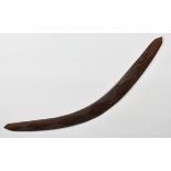 An Aboriginal boomerang probably first half 20th century, with pointed ends, one side with incised