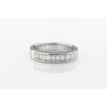 An 18ct white gold and diamond half eternity ring hallmarked '18K 750', channel set with ten