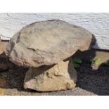 A Guernsey granite mushroom with short base the base approximately 11 inches in height, plus cap