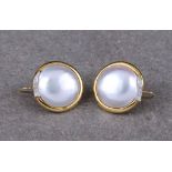 A pair of Italian 18 carat gold Mabé pearl and diamond earrings each with a central Mabé pearl,