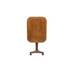 A William IV mahogany tilt-top table the rectangular top with rounded angles, on a tapered octagonal