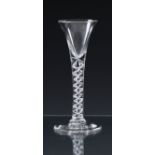 A mid-18th century mercurial airtwist tall wine glass c.1750, the drawn trumpet bowl on a