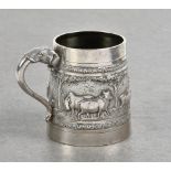 An Indian silver repoussé decorated tankard T.P.R. & Co, Bombay, cylindrical tapering form, having