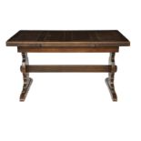 A mid 20th century stained oak draw leaf table on shaped trestle supports with a central