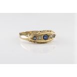 An antique 18ct gold, sapphire and diamond five stone ring hallmarked Birm. 1917, with three