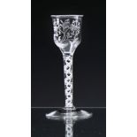 A mid-18th century engraved opaque twist wine glass, of possible Jacobite significance c.1765, the