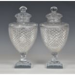 A good pair of Georgian style cut glass covered urns