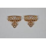 A 9ct rose gold openwork two-part nurse's buckle scroll work decorated, unmarked, tested, (19.