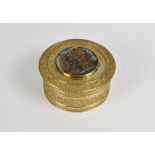 Napoleonic interest - A 19th century French gilt bronze circular box the lidded top centred by a