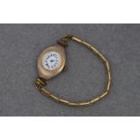 An antique 9ct rose gold cased ladies wrist watch hallmarked London 1915, the manual wind movement