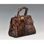 A Salvatore Ferragamo leopard print The Studio top handle tote bag the pony hide bag with leopard