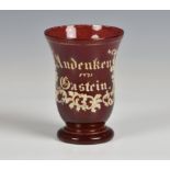 A 19th century Bohemian ruby flashed and enamelled glass beaker