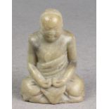 A carved hard stone figure of Buddha 5in. (12.7cm.) high. *Natural flaws, surface marks and tiny