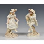 A pair of Royal Worcester figural spill vases circa 1885