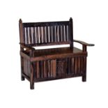 An Oriental carved coromandel wood settle probably late 19th century, the slatted back with