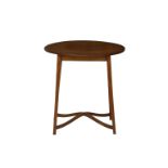 An Edwardian crossbanded oval mahogany occasional table the line inlaid and crossbanded oval top