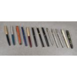 A collection of vintage pens and pencils To include silver Sheaffer three piece pen pencil set;