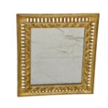 A small giltwood Florentine style mirror frame 15 x 17in. (38.1 x 43.1cm.).