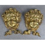 A pair of 19th century brass wall mounted heads of young Bacchus each with grape vines in their hair