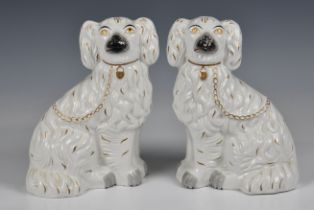 A pair of Staffordshire King Charles spaniels