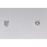 A pair of 18ct white gold and diamond stud earrings, two round brilliant-cut diamonds total 0.