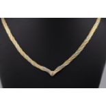 A 9ct tri-coloured gold necklace, with alternating herringbone rows of yellow, rose and white