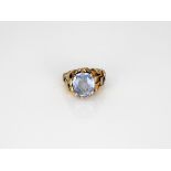 A 1970s tri-colur gold and sapphire dress ring, in the style of Andrew Grima, the pale cushion-cut