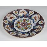 A Continental, 18th century, faience dished platter