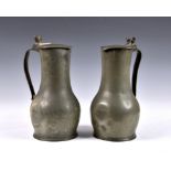 A pair of 18th century Channel Islands pewter measures Jersey, each stamped 'IN' to inner lid for