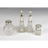 Group of dressing table items comprising; a pair of cut glass perfume bottles with silver mounts,