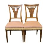 A pair of Biedermeier satin walnut and ebony inlaid side chairs first half 19th century, the