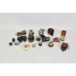 A collection of various vintage light / exposure meters and view finders to include a Leica Meter MR